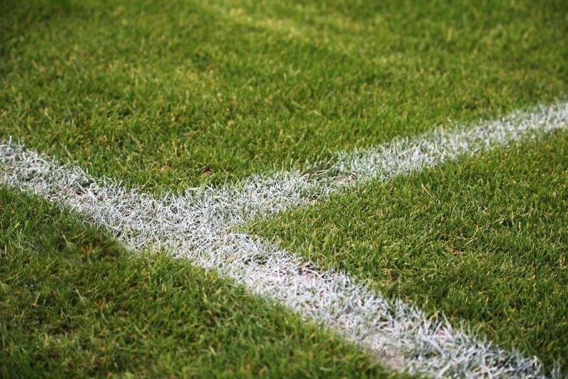 Closeup Shot Of Painted White Lines On A Green Soccer Field In Germany